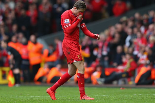 LIVERPOOL, ENGLAND - APRIL 13: Jordan Henderson of Liverpool walks off after being shown a red card by Referee Mark Clattenburg during the Barclays Premier League match between Liverpool and Manchester City at Anfield on April 13, 2014 in Liverpool, England. (Photo by Alex Livesey/Getty Images) LIVERPOOL, ENGLAND - APRIL 13: Jordan Henderson of Liverpool walks off after being shown a red card by Referee Mark Clattenburg during the Barclays Premier League match between Liverpool and Manchester City at Anfield on April 13, 2014 in Liverpool, England. (Photo by Alex Livesey/Getty Images)