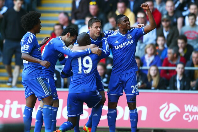 SWANSEA, WALES - APRIL 13: Demba Ba #19 of Chelsea is congratulated by teammates after scoring the opening goal during the Barclays Premier League match between Swansea City and Chelsea at Liberty Stadium on April 13, 2014 in Swansea, Wales. (Photo by Michael Steele/Getty Images) SWANSEA, WALES - APRIL 13: Demba Ba #19 of Chelsea is congratulated by teammates after scoring the opening goal during the Barclays Premier League match between Swansea City and Chelsea at Liberty Stadium on April 13, 2014 in Swansea, Wales. (Photo by Michael Steele/Getty Images)