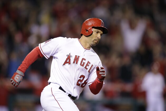 Los Angeles Angels' Raul Ibanez rounds the bases after hitting a three-run home run for his 2000th career hit during the ninth inning of a baseball game against the New York Mets on Saturday, April 12, 2014, in Anaheim, Calif. (AP Photo/Jae C. Hong)