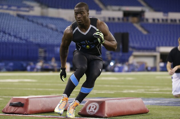 Boston Col linebacker Kevin Pierre-Louis runs a drill at the NFL football scouting combine in Indianapolis, Monday, Feb. 24, 2014. (AP Photo/Michael Conroy)