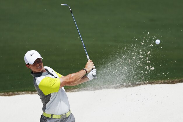 Rory McIlroy, of Northern Ireland, hits out of a bunker on the second hole during the fourth round of the Masters golf tournament Sunday, April 13, 2014, in Augusta, Ga. (AP Photo/Matt Slocum)