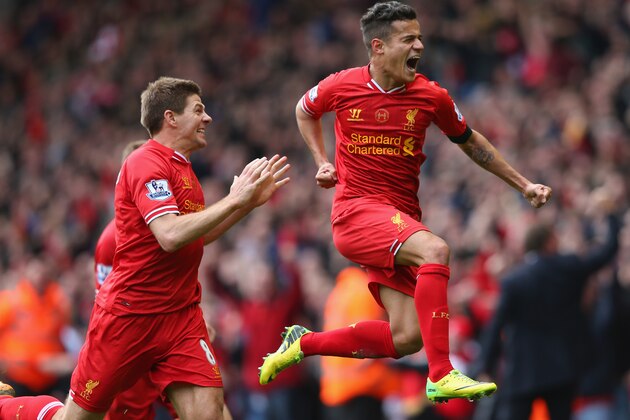 LIVERPOOL, ENGLAND - APRIL 13:  Philippe Coutinho of Liverpool celebrates scoring his team's third goal during the Barclays Premier League match between Liverpool and Manchester City at Anfield on April 13, 2014 in Liverpool, England.  (Photo by Alex Livesey/Getty Images)