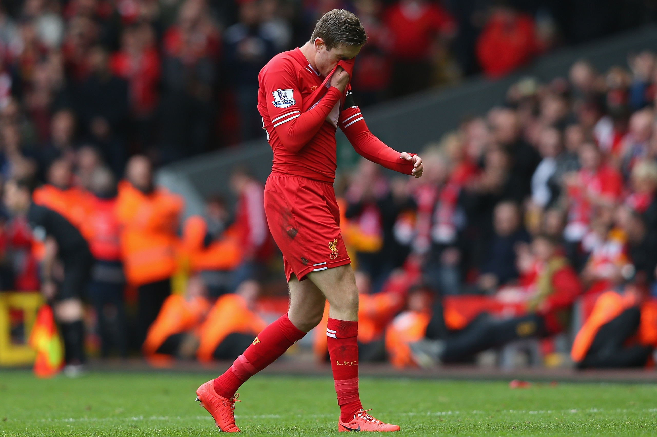 LIVERPOOL, ENGLAND - APRIL 13:  Jordan Henderson of Liverpool walks off after being shown a red card by Referee Mark Clattenburg during the Barclays Premier League match between Liverpool and Manchester City at Anfield on April 13, 2014 in Liverpool, England.  (Photo by Alex Livesey/Getty Images)