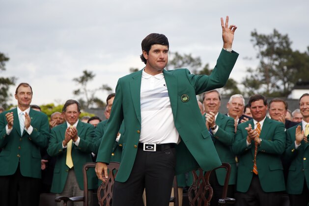 Bubba Watson waves after being presented with his green jacket after winning the Masters golf tournament Sunday, April 13, 2014, in Augusta, Ga.  (AP Photo/Matt Slocum)