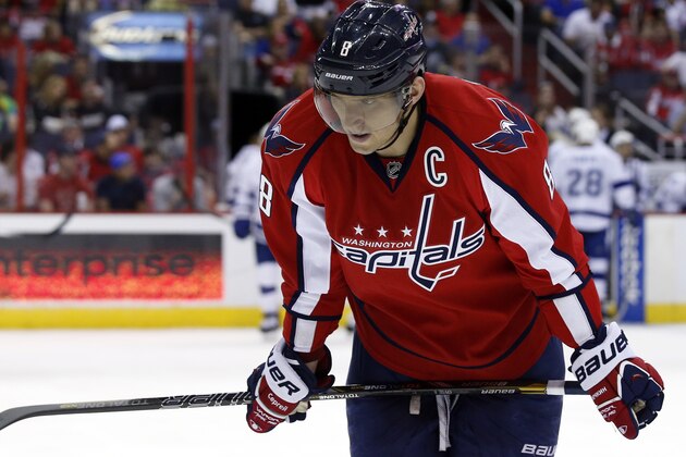 Washington Capitals right wing Alex Ovechkin (8), from Russia, pauses on the ice during a break in the second period of an NHL hockey game against the Tampa Bay Lightning, Sunday, April 13, 2014, in Washington. (AP Photo/Alex Brandon)