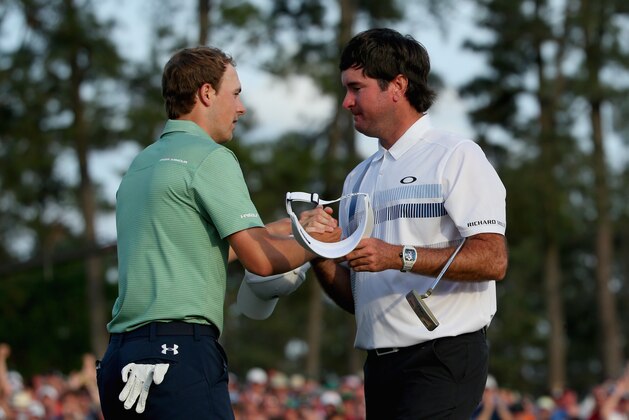AUGUSTA, GA - APRIL 13:  Bubba Watson of the United States shakes hands with Jordan Spieth on the 18th green after Watson won the 2014 Masters Tournament by a three-stroke margin at Augusta National Golf Club on April 13, 2014 in Augusta, Georgia.  (Photo by Andrew Redington/Getty Images)