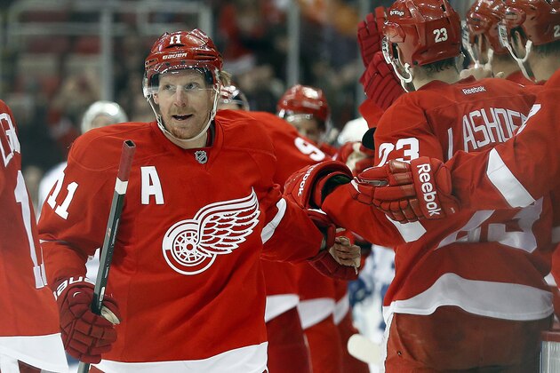 Detroit Red Wings right wing Daniel Alfredsson (11), of Sweden, celebrates his goal against the Toronto Maple Leafs in the third period of an NHL hockey game in Detroit, Tuesday, March 18, 2014. Detroit won 3-2. (AP Photo/Paul Sancya)