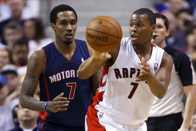 Apr 13, 2014; Auburn Hills, MI, USA; Toronto Raptors guard Kyle Lowry (7) passes the ball away from Detroit Pistons guard Brandon Jennings (7) in the second half at The Palace of Auburn Hills. Mandatory Credit: Rick Osentoski-USA TODAY Sports