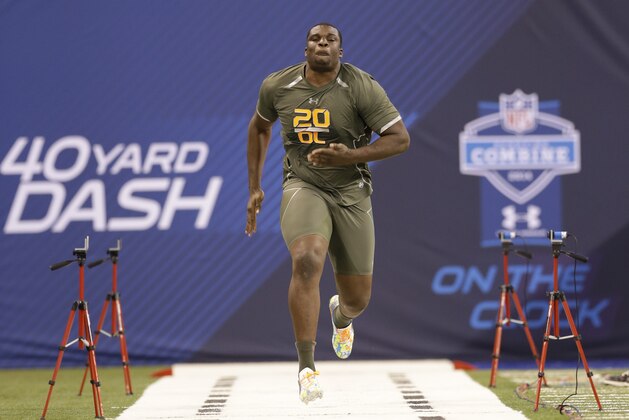 Alabama offensive lineman Cyrus Kouandjio runs the 40-yard dash at the NFL football scouting combine in Indianapolis, Saturday, Feb. 22, 2014. (AP Photo/Nam Y. Huh)