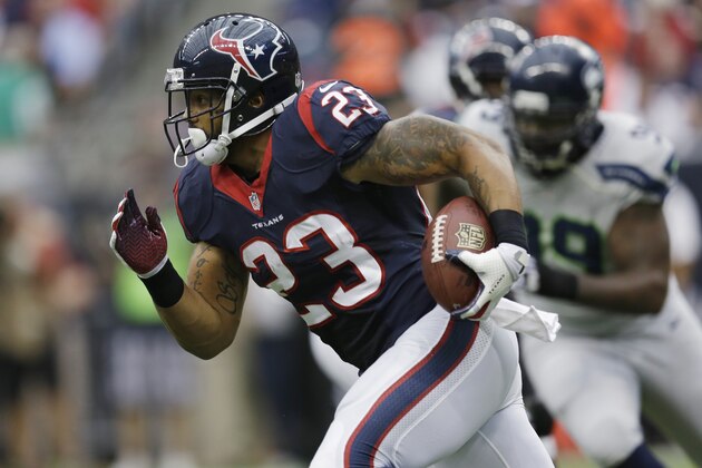 Houston Texans' Arian Foster (23) runs against the Seattle Seahawks during the first quarter an NFL football game Sunday, Sept. 29, 2013, in Houston. (AP Photo/David J. Phillip)