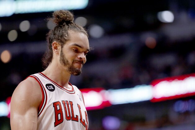 Chicago Bulls center Joakim Noah walks towards the bench during the closing minutes of an NBA basketball game against the Portland Trail Blazers Friday, March 28, 2014, in Chicago. The Trail Blazers won 91-74. (AP Photo/Charles Rex Arbogast)