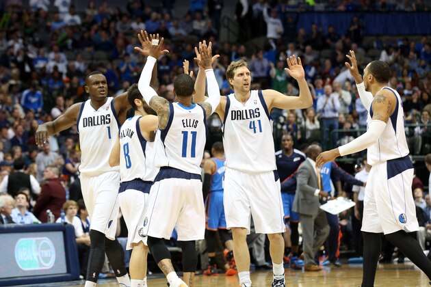 DALLAS, TX - MARCH 25:  Dirk Nowitzki #41 of the Dallas Mavericks celebrates with his teammates during the game against the Oklahoma City Thunder on March 25, 2014 at the American Airlines Center in Dallas, Texas. NOTE TO USER: User expressly acknowledges and agrees that, by downloading and or using this Photograph, user is consenting to the terms and conditions of the Getty Images License Agreement. Mandatory Copyright Notice: Copyright 2014 NBAE (Photo by Layne Murdoch/NBAE via Getty Images)