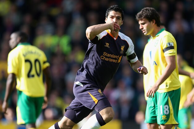 NORWICH, ENGLAND - SEPTEMBER 29:  Luis Suarez of Liverpool celebrates scoring their first goal during the Barclays Premier League match between Norwich City and Liverpool at Carrow Road on September 29, 2012 in Norwich, England.  (Photo by Julian Finney/Getty Images)