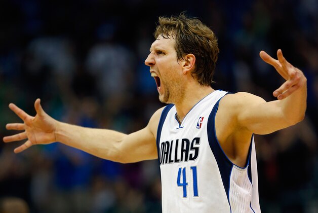 DALLAS, TX - APRIL 12:  Dirk Nowitzki #41 of the Dallas Mavericks reacts after making a three point shot against the Phoenix Suns in the third quarter at American Airlines Center on April 12, 2014 in Dallas, Texas.  (Photo by Tom Pennington/Getty Images)
