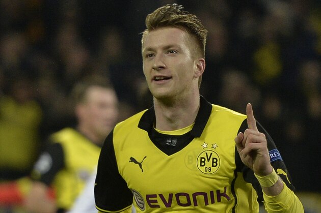 Dortmund's Marco Reus celebrates scoring his side's 2nd goal during the Champions League quarterfinal second leg soccer match between Borussia Dortmund and Real Madrid in the Signal Iduna stadium in Dortmund, Germany, Tuesday, April 8, 2014. (AP Photo/Martin Meissner)