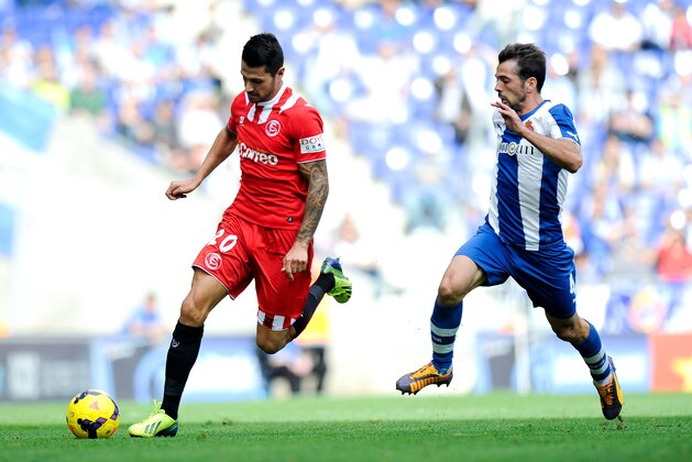 BARCELONA, SPAIN - NOVEMBER 10:  Victor Machin of Sevilla FC duels for the ball with Victor Sanchez of RCD Espanyol during the La Liga match between RCD Espanyol and Sevilla FC at Cornella-El Prat Stadium on November 10, 2013 in Barcelona, Spain.  (Photo by David Ramos/Getty Images)