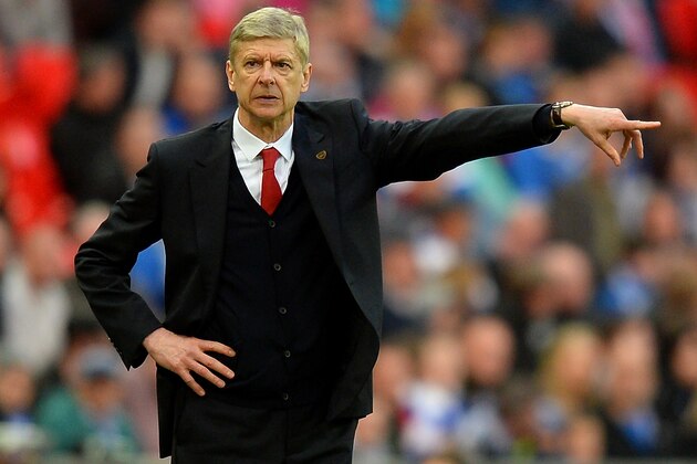 LONDON, ENGLAND - APRIL 12:  Arsene Wenger, manager of Arsenal signals during the FA Cup Semi-Final match between Wigan Athletic and Arsenal at Wembley Stadium on April 12, 2014 in London, England.  (Photo by Mike Hewitt/Getty Images)