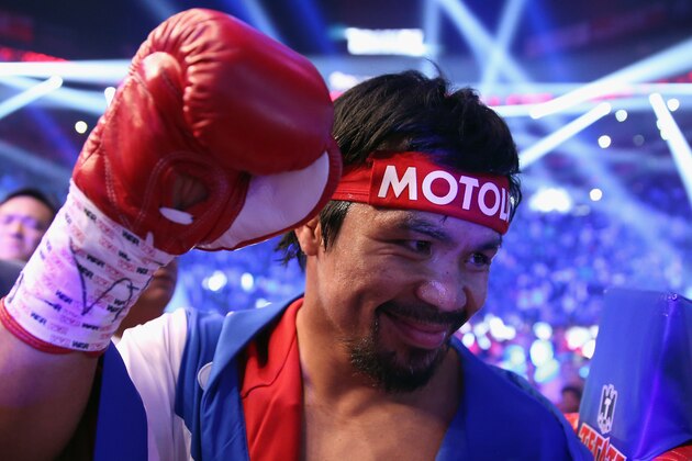 LAS VEGAS, NV - APRIL 12: Manny Pacquiao acknowledges people in the crowd prior to fighting Timothy Bradley at the MGM Grand Garden Arena on April 12, 2014 in Las Vegas, Nevada. (Photo by Jeff Gross/Getty Images) LAS VEGAS, NV - APRIL 12: Manny Pacquiao acknowledges people in the crowd prior to fighting Timothy Bradley at the MGM Grand Garden Arena on April 12, 2014 in Las Vegas, Nevada. (Photo by Jeff Gross/Getty Images)