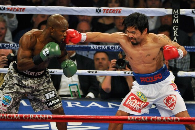 LAS VEGAS, NV - APRIL 12:  Timothy Bradley (L) and Manny Pacquiao battle it out during their WBO world welterweight championship boxing match at the MGM Grand Garden Arena on April 12, 2014 in Las Vegas, Nevada. Pacquiao won by unanimous decision.  (Photo by David Becker/Getty Images)