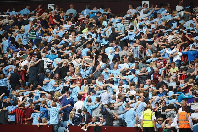 BIRMINGHAM, ENGLAND - AUGUST 12:  Manchester City fans do the Poznan celebration during the FA Community Shield match between Manchester City and Chelsea at Villa Park on August 12, 2012 in Birmingham, England.  (Photo by Laurence Griffiths/Getty Images)