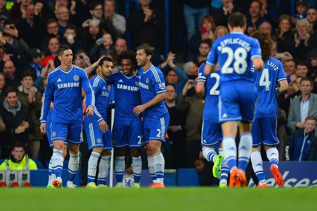LONDON, ENGLAND - APRIL 05:  Willian of Chelsea is congratulated by Branislav Ivanovic and Mohamed Salah of Chelsea on scoring their third goal during the Barclays Premier League match between Chelsea and Stoke City at Stamford Bridge on April 5, 2014 in London, England.  (Photo by Mike Hewitt/Getty Images)