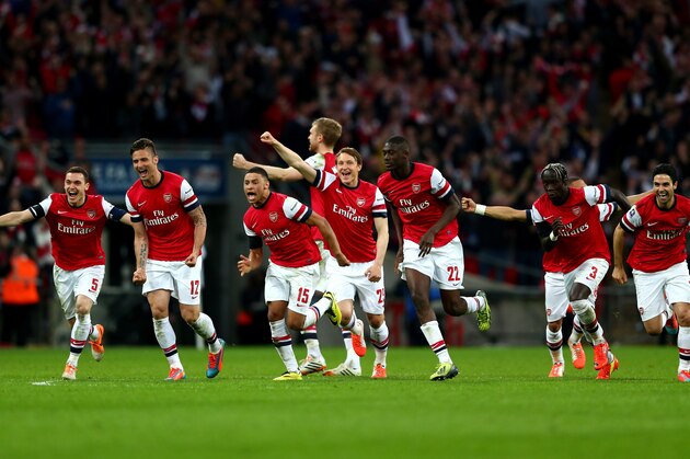 LONDON, ENGLAND - APRIL 12:  Arsenal celebrate as the win 4:2 in the penalty shoot out during the FA Cup Semi-Final match between Wigan Athletic and Arsenal at Wembley Stadium on April 12, 2014 in London, England.  (Photo by Michael Steele/Getty Images)