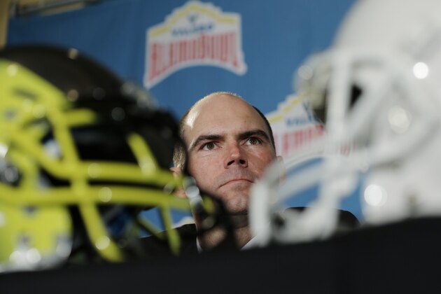Oregon coach Mark Helfrich listens to a question during a Valero Alamo Bowl news conference, Thursday,  Dec. 12, 2013, in San Antonio. Texas and Oregon will play in the NCAA college football game Dec. 30. (AP Photo/Eric Gay)