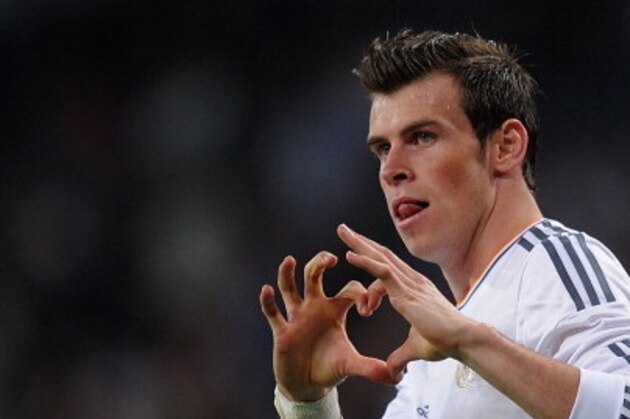 MADRID, SPAIN - APRIL 12:  Gareth Bale of Real Madrid celebrates after scoring Real's 2nd goal during the La Liga match between Real Madrid and Almeria at Santiago Bernabeu stadium on April 12, 2014 in Madrid, Spain.  (Photo by Denis Doyle/Getty Images)