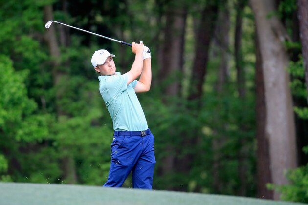 AUGUSTA, GA - APRIL 13:  Jordan Spieth of the United States hits his second shot on the 11th hole during the final round of the 2014 Masters Tournament at Augusta National Golf Club on April 13, 2014 in Augusta, Georgia.  (Photo by Rob Carr/Getty Images)