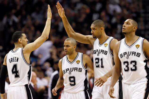 SAN ANTONIO, TX - JUNE 16:  (L-R) Danny Green #4, Tony Parker #9, Tim Duncan #21 and Boris Diaw #33 of the San Antonio Spurs celebrate in the fourth quarter against the Miami Heat during Game Five of the 2013 NBA Finals at the AT&T Center on June 16, 2013 in San Antonio, Texas. NOTE TO USER: User expressly acknowledges and agrees that, by downloading and or using this photograph, User is consenting to the terms and conditions of the Getty Images License Agreement.  (Photo by Kevin C. Cox/Getty Images)