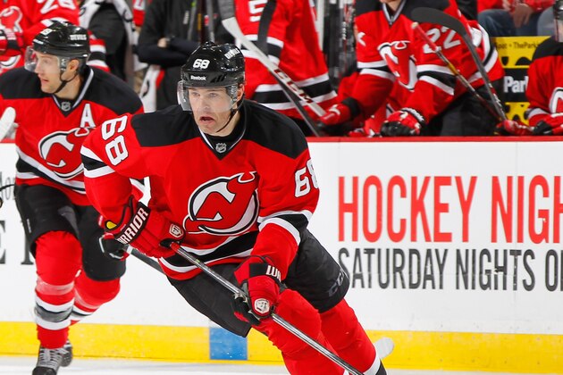 NEWARK, NJ - APRIL 04: Jaromir Jagr #68 of the New Jersey Devils plays the puck against the Washington Capitals during the game at the Prudential Center on April 4, 2014 in Newark, New Jersey. (Photo by Andy Marlin/NHLI via Getty Images)