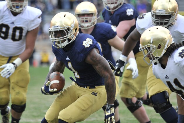 Notre Dame running back Greg Bryant heads up field during the Blue Gold game an  NCAA football game marking the end of spring practice at Notre Dame Stadium Saturday April 12, 2014 in South Bend, Ind. (AP Photo/Joe Raymond)