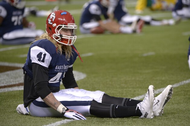 West linebacker Tyler Starr (41), of South Dakota, stretches prior to an East-West Shrine Classic NCAA football game in St. Petersburg, Fla., Saturday, Jan. 18, 2014.(AP Photo/Phelan M. Ebenhack)
