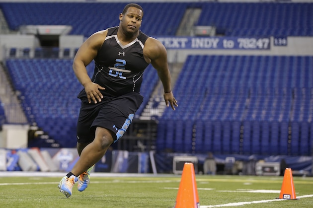 Arkansas State defensive lineman Ryan Carrethers runs a drill at the NFL football scouting combine in Indianapolis, Monday, Feb. 24, 2014. (AP Photo/Michael Conroy)