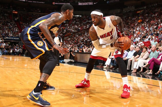 MIAMI, FL - APRIL 11: LeBron James #6 of the Miami Heat handles the ball against the Indiana Pacers during a game on April 11, 2014 at American Airlines Arena in Miami, Florida.  NOTE TO USER: User expressly acknowledges and agrees that, by downloading and or using this photograph, User is consenting to the terms and conditions of the Getty Images License Agreement. Mandatory Copyright Notice: Copyright 2014 NBAE  (Photo by Nathaniel S. Butler/NBAE via Getty Images)