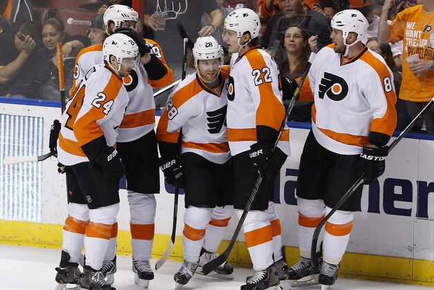 Apr 8, 2014; Sunrise, FL, USA; Philadelphia Flyers center Claude Giroux (28) celebrates his goal against the Florida Panthers with defenseman Luke Schenn (22) with right wing Matt Read (24)  defenseman Nicklas Grossmann (8)and right wing Jakub Voracek (93) in the second period at BB&T Center. Mandatory Credit: Robert Mayer-USA TODAY Sports