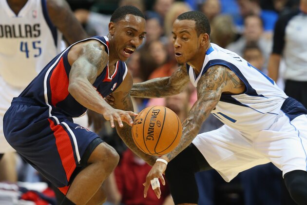 DALLAS, TX - OCTOBER 30:  (L-R) Jeff Teague #0 of the Atlanta Hawks dribbles the ball against Monta Ellis #11 of the Dallas Mavericks at American Airlines Center on October 30, 2013 in Dallas, Texas.  NOTE TO USER: User expressly acknowledges and agrees that, by downloading and or using this photograph, User is consenting to the terms and conditions of the Getty Images License Agreement.  (Photo by Ronald Martinez/Getty Images)