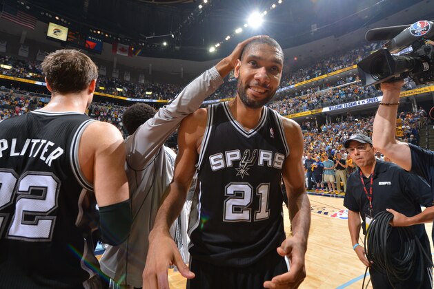 MEMPHIS, TN - MAY 27: Tim Duncan #21 of the San Antonio Spurs smiles as he walks into the lockerroom after winning the game against the Memphis Grizzlies after Game Four of the Western Conference Finals during the 2013 NBA Playoffs on May 27, 2013 at FedEx Forum in Memphis, Tennessee. NOTE TO USER: User expressly acknowledges and agrees that, by downloading and or using this photograph, User is consenting to the terms and conditions of the Getty Images License Agreement. Mandatory Copyright Notice: Copyright 2013 NBAE (Photo by Jesse D. Garrabrant/NBAE via Getty Images)