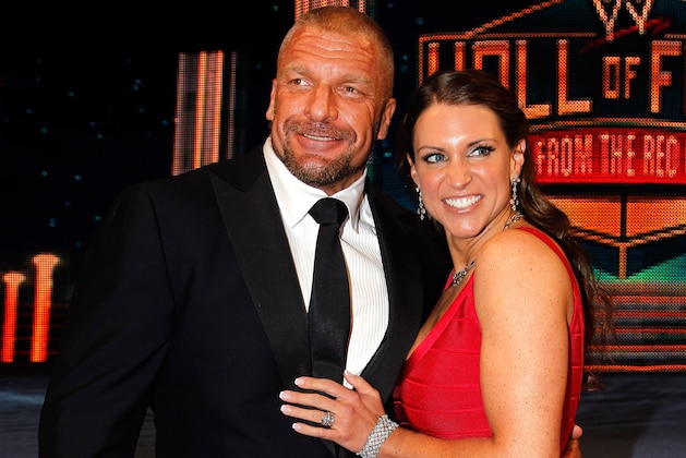 Paul Levesque aka Triple H and Stephanie McMahon are seen at the WWE Hall of Fame Induction at the Smoothie King Center in New Orleans on Saturday, April 5, 2014. (Jonathan Bachman/AP Images for WWE)
