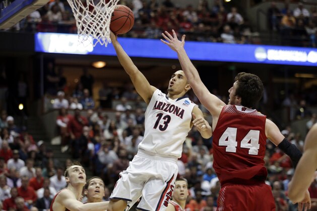 Arizona's Nick Johnson shoots during the second half in a regional final NCAA college basketball tournament game against Wisconsin, Saturday, March 29, 2014, in Anaheim, Calif. (AP Photo/Jae C. Hong)