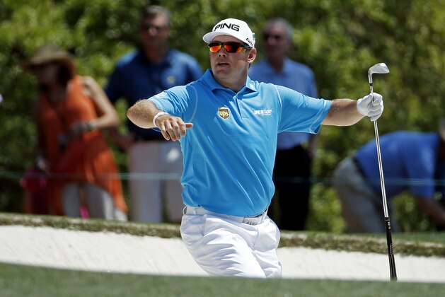 Lee Westwood, of England, looks for his shot out of a bunker on the first fairway during the third round of the Masters golf tournament Saturday, April 12, 2014, in Augusta, Ga. (AP Photo/Matt Slocum)