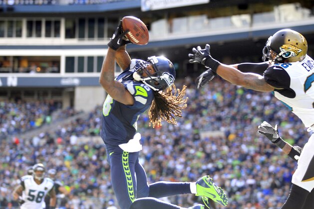 Seattle Seahawks' Sidney Rice, front left, snags the ball in the end zone for a touchdown in front of Jacksonville Jaguars' Josh Evans in the second half of an NFL football game on Sunday, Sept. 22, 2013, in Seattle. (AP Photo/Stephen Brashear) Seattle Seahawks' Sidney Rice, front left, snags the ball in the end zone for a touchdown in front of Jacksonville Jaguars' Josh Evans in the second half of an NFL football game on Sunday, Sept. 22, 2013, in Seattle. (AP Photo/Stephen Brashear)
