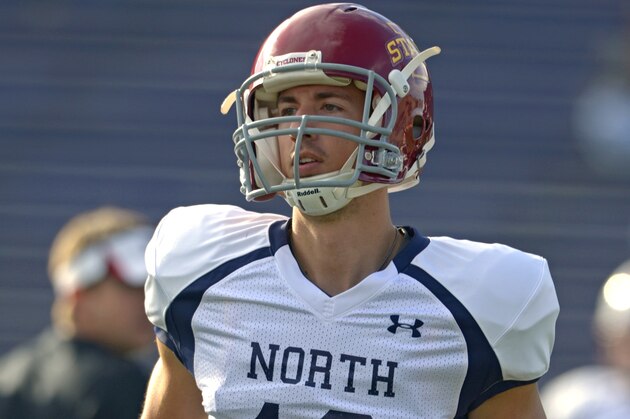 North Squad punter Kirby Van Der Kamp of Iowa State (13) runs on to the field during Senior Bowl practice at Ladd-Peebles Stadium, Monday, Jan. 20, 2014 in Mobile, Ala. (AP Photo/G.M. Andrews)