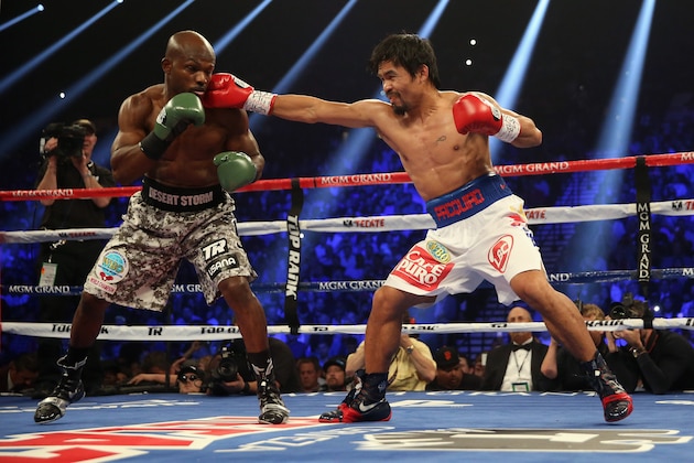 LAS VEGAS, NV - APRIL 12:  Manny Pacquiao lands a right hand to the head of Timothy Bradley at the MGM Grand Garden Arena on April 12, 2014 in Las Vegas, Nevada.  (Photo by Jeff Gross/Getty Images)