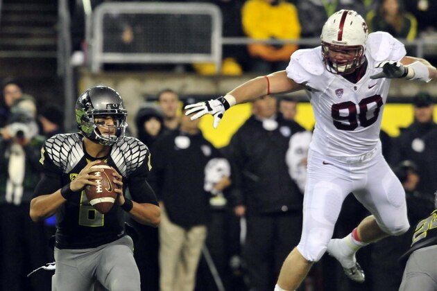 EUGENE, OR - NOVEMBER 17: Quarterback Marcus Mariota #8 of the Oregon Ducks eludes the rush of defensive end Josh Mauro #90 of the Stanford Cardinal during the first quarter of the game at Autzen Stadium on November 17, 2012 in Eugene, Oregon. (Photo by Steve Dykes/Getty Images) EUGENE, OR - NOVEMBER 17: Quarterback Marcus Mariota #8 of the Oregon Ducks eludes the rush of defensive end Josh Mauro #90 of the Stanford Cardinal during the first quarter of the game at Autzen Stadium on November 17, 2012 in Eugene, Oregon. (Photo by Steve Dykes/Getty Images)