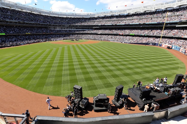 Sep 22, 2013; Bronx, NY, USA; New York Yankees pitcher Mariano Rivera (42) enters the field from the bull pen as heavy metal band Metallica plays