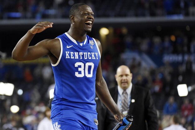 Apr 5, 2014; Arlington, TX, USA; Kentucky Wildcats forward Julius Randle (30) celebrates after defeating the Wisconsin Badgers in the semifinals of the Final Four in the 2014 NCAA Mens Division I Championship tournament at AT&T Stadium. Mandatory Credit: Robert Deutsch-USA TODAY Sports