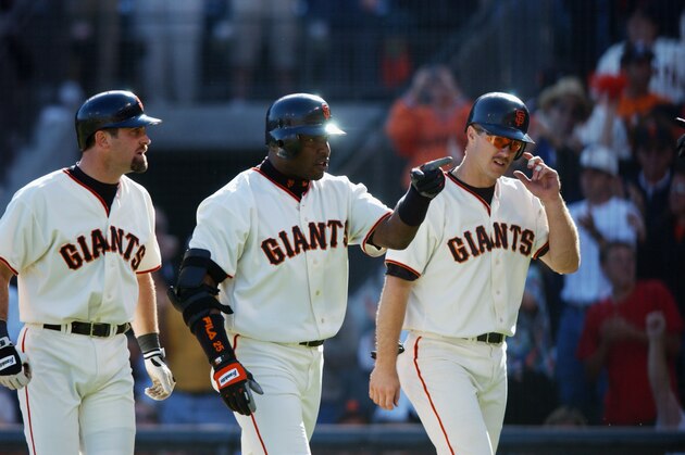 SAN FRANCISCO - OCTOBER 12:  (L-R) Shortstop Rich Aurilia #35, left fielder Barry Bonds #25, and second baseman Jeff Kent #21 of the San Francisco Giants walk to the dugout after Barry Bonds' three run home run in the fifth inning against the St. Louis Cardinals in Game three of the National League Championship Series during the 2002 World Series at Pacific Bell Park on October 12, 2002 in San Francisco, California.  Cardinals defeated the Giants 5-4  (Photo by Doug Pensinger/Getty Images)