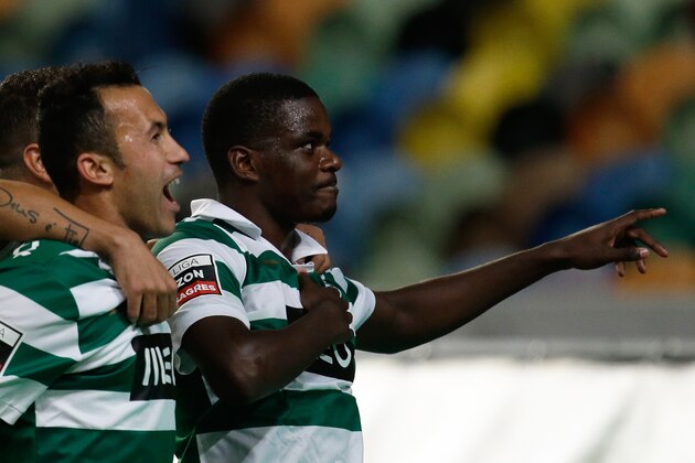 Sporting's William Carvalho, right, celebrates after scoring the opening goal against Pacos de Ferreira during their Portuguese league soccer match Sunday, Dec. 1, 2013, at Sporting's Alvalade stadium in Lisbon. (AP Photo/Armando Franca) Sporting's William Carvalho, right, celebrates after scoring the opening goal against Pacos de Ferreira during their Portuguese league soccer match Sunday, Dec. 1, 2013, at Sporting's Alvalade stadium in Lisbon. (AP Photo/Armando Franca)