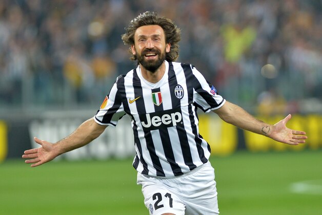 Juventus midfielder Andrea Pirlo  celebrates after scoring during the Europa League quarterfinal soccer match between Juventus and Olympic Lyon at the Juventus stadium, in Turin, Italy, Thursday, April 10, 2014. (AP Photo/ Massimo Pinca)
